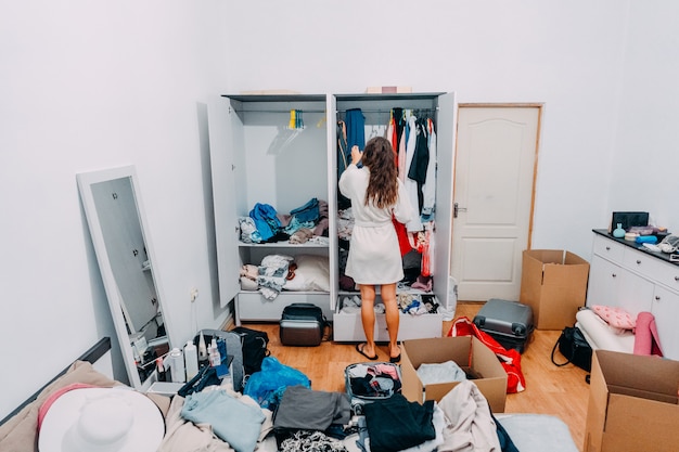 Nice looking lady inside modern apartment room prepare to trip