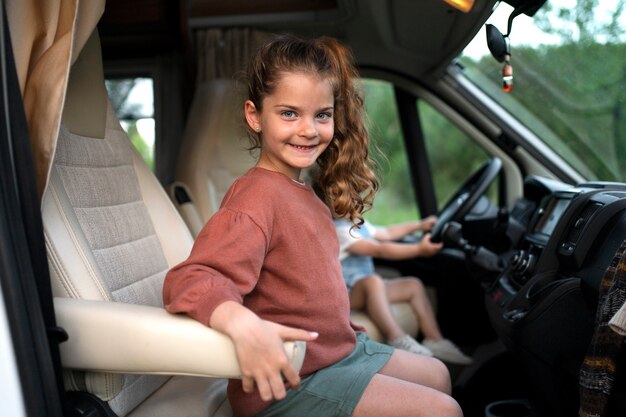 Nomad family child having fun in the van