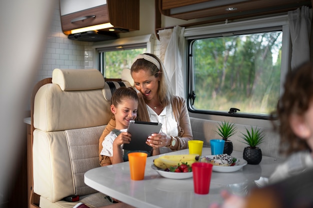 Nomad family having fun together in tiny house