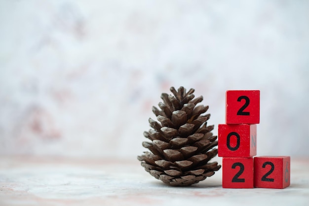 Non-adjacent lined upred cubes with numbers as a new year and christmas concept on blurred background