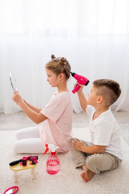 Non binary children playing a beauty salon game