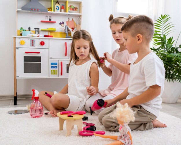 Non binary children playing together a beauty salon game