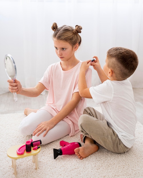 Non binary kids playing a beauty salon game