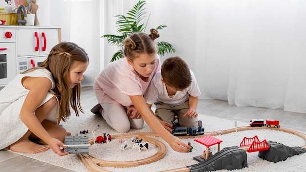 Non-binary kids playing with cars game