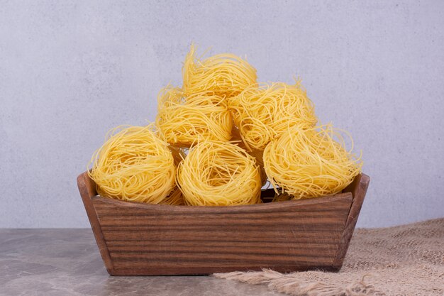 Noodle tops isolated on marble surface