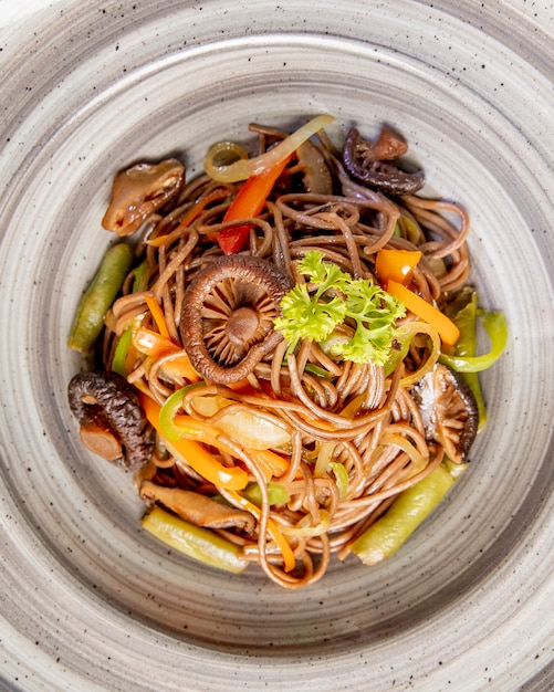 Free Photo noodles prepared with mushrooms bell peppers and sauce