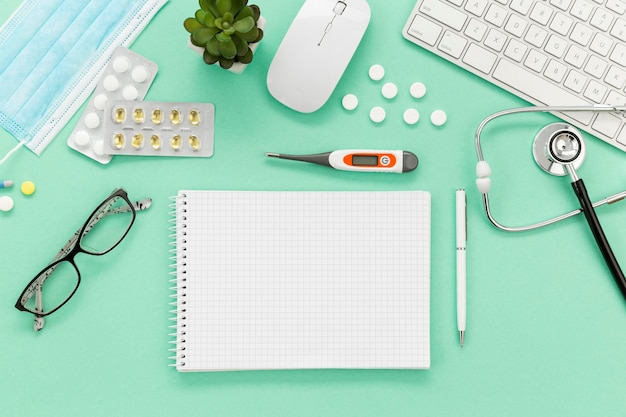 Notebook and medicine on desk