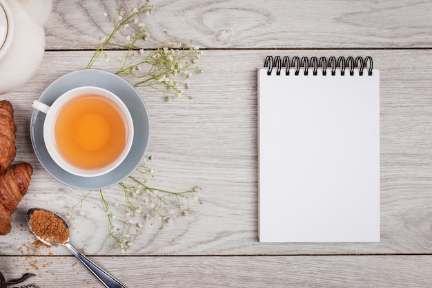 Notebook mock-up on wooden background