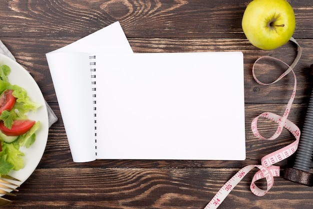 Notebook and salad arrangement