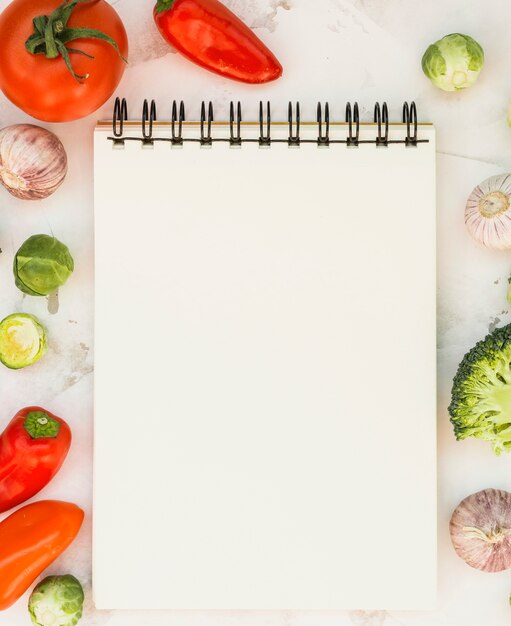 Notebook and vegetables