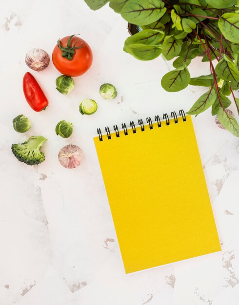 Notebook and vegetables