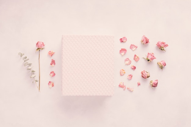 Free photo notebook with rose flower on table