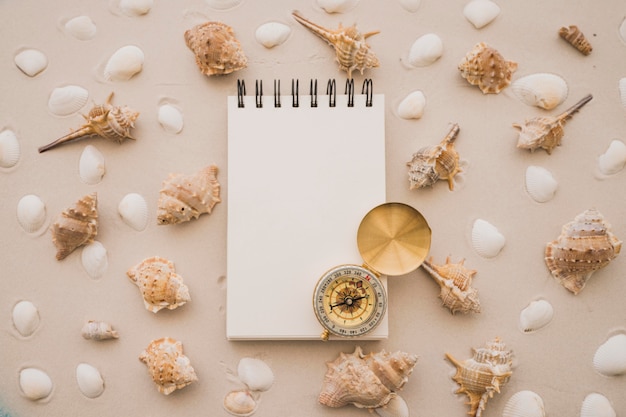 Free Photo notepad, compass and seashells