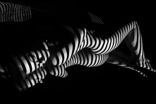 Free photo the nude woman with black and white zebra stripes