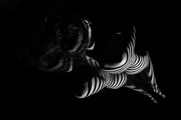 The nude woman with black and white zebra stripes