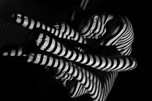 The nude woman with black and white zebra stripes