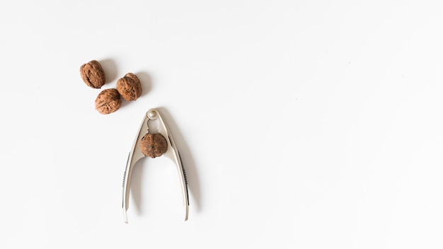 Free photo nutcracker with walnut on table