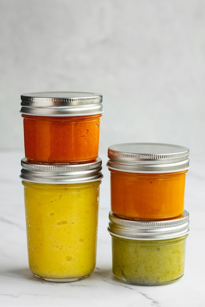 Nutritious baby food in jars arrangement