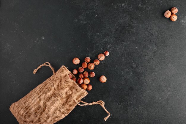 Nuts out of a rustic burlap case. 