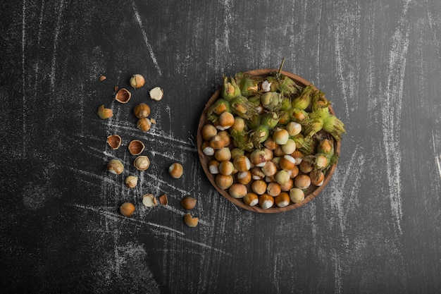 Nuts in shells with green leaves