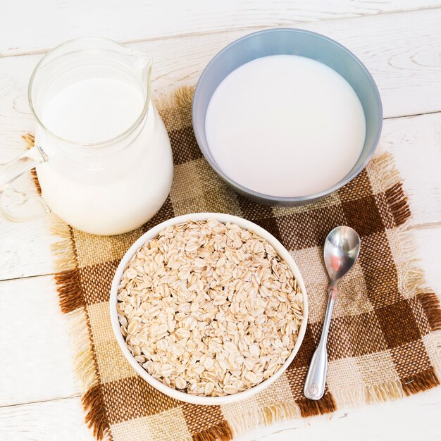 Oatmeal bowl and jar of milk