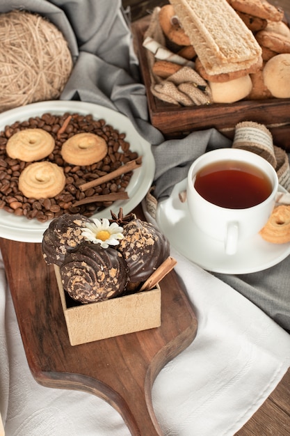 Oatmeal and chocolate cookies with a cup of tea