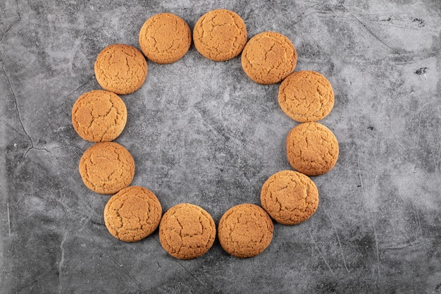 Free photo oatmeal cookies isolated on grey concrete.