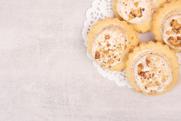 Oatmeal raisin cookies on white table.