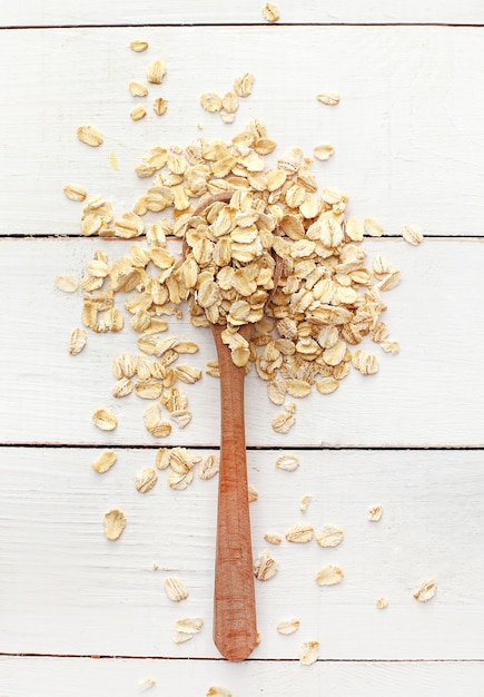 Oats on wooden spoon