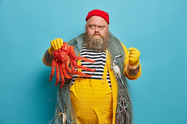 Obese bearded male sailor wiith fishing net