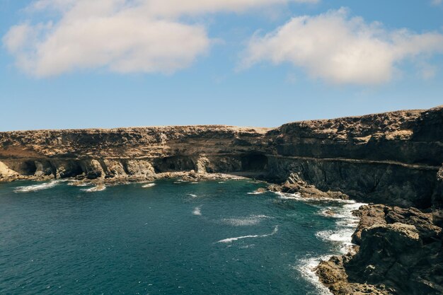 Ocean near rocky shore in summer