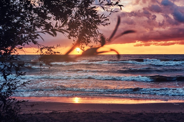 Ocean waves, amazing cloudy sky, beautiful sunset. Evening seascape