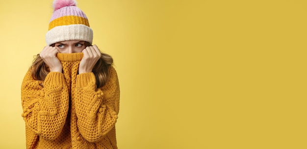 Free Photo offended sad whining cute tender young girl hiding face pull sweater nose peek look aside insulted c