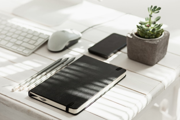 Free photo office desk table with computer, supplies and phone