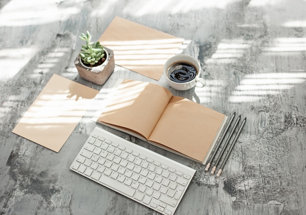 Office desk table with computer, supplies and phone