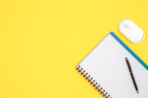 Office desk workspace on bright color yellow background