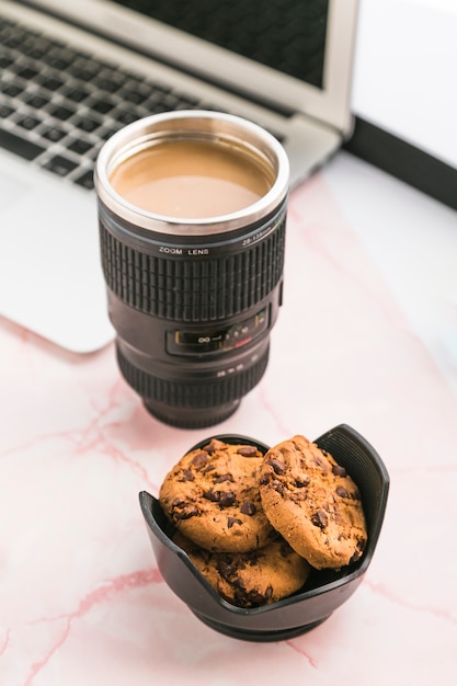 Free photo office desktop with a coffee cup and cookies