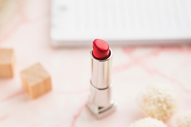 Office desktop with a lipstick