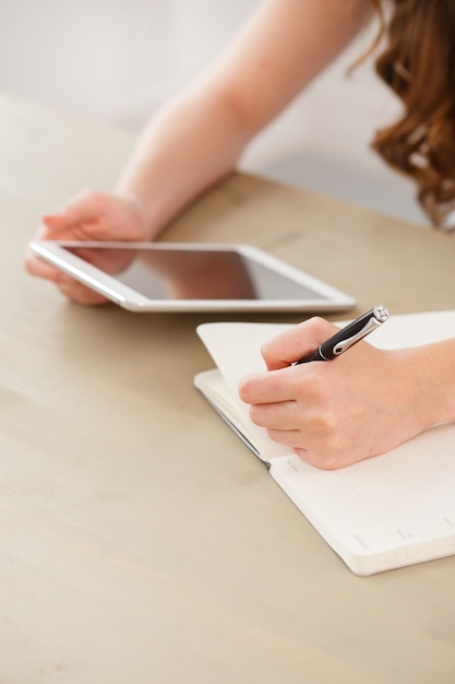 Office, home. woman by the table