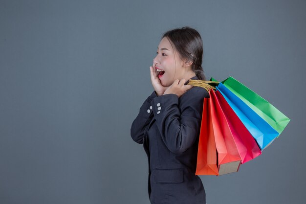 Office lady holding a fashion shopping bag