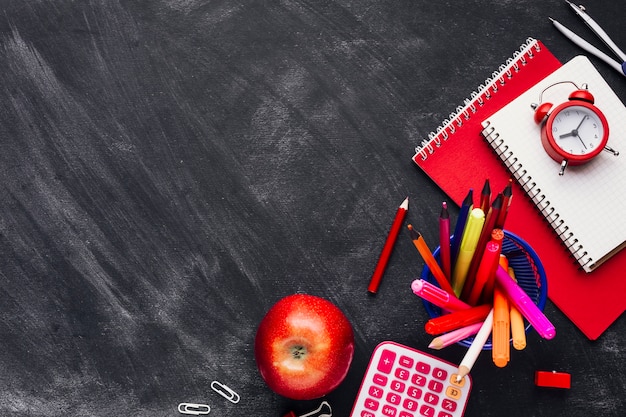 Office stationery placed on blackboard