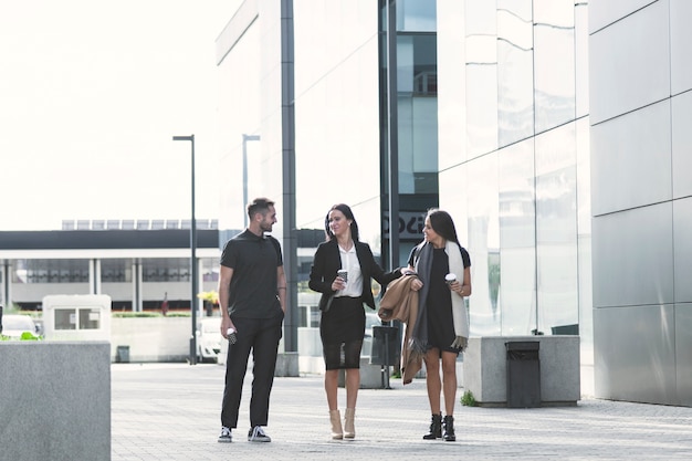 Office workers standing on street