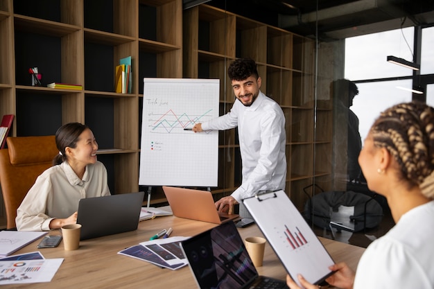 Free photo office workers using finance graphs