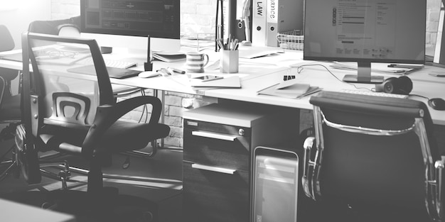 Office workspace with computers grayscale