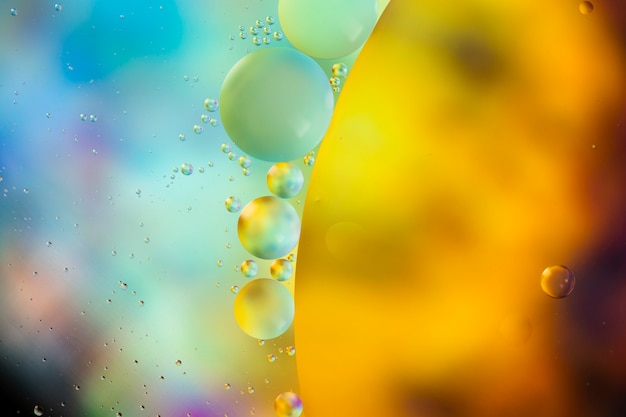 Free photo oil drops on a water surface abstract background