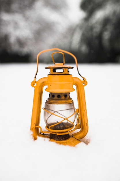 Free photo oil lamp on snow