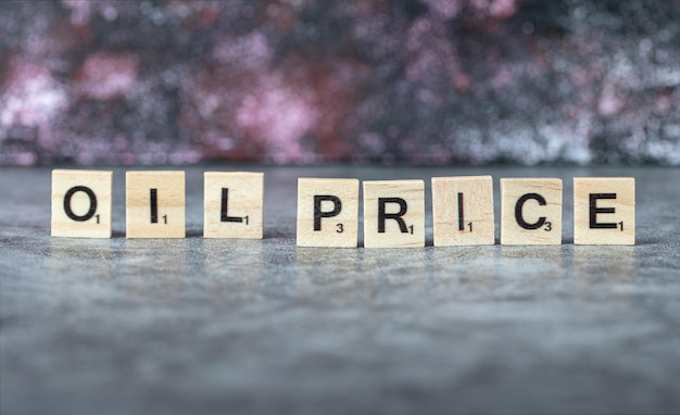 Free photo oil price writing with black letters on wooden dices in horizontal manner. high quality photo