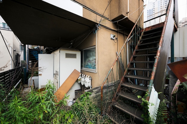 Free photo old abandoned house with rusty stairs