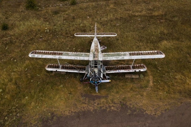 Free photo old abandoned small airplane in the field