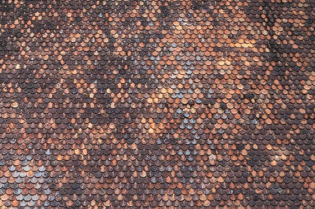 Free photo old brown roof tile pattern background texture